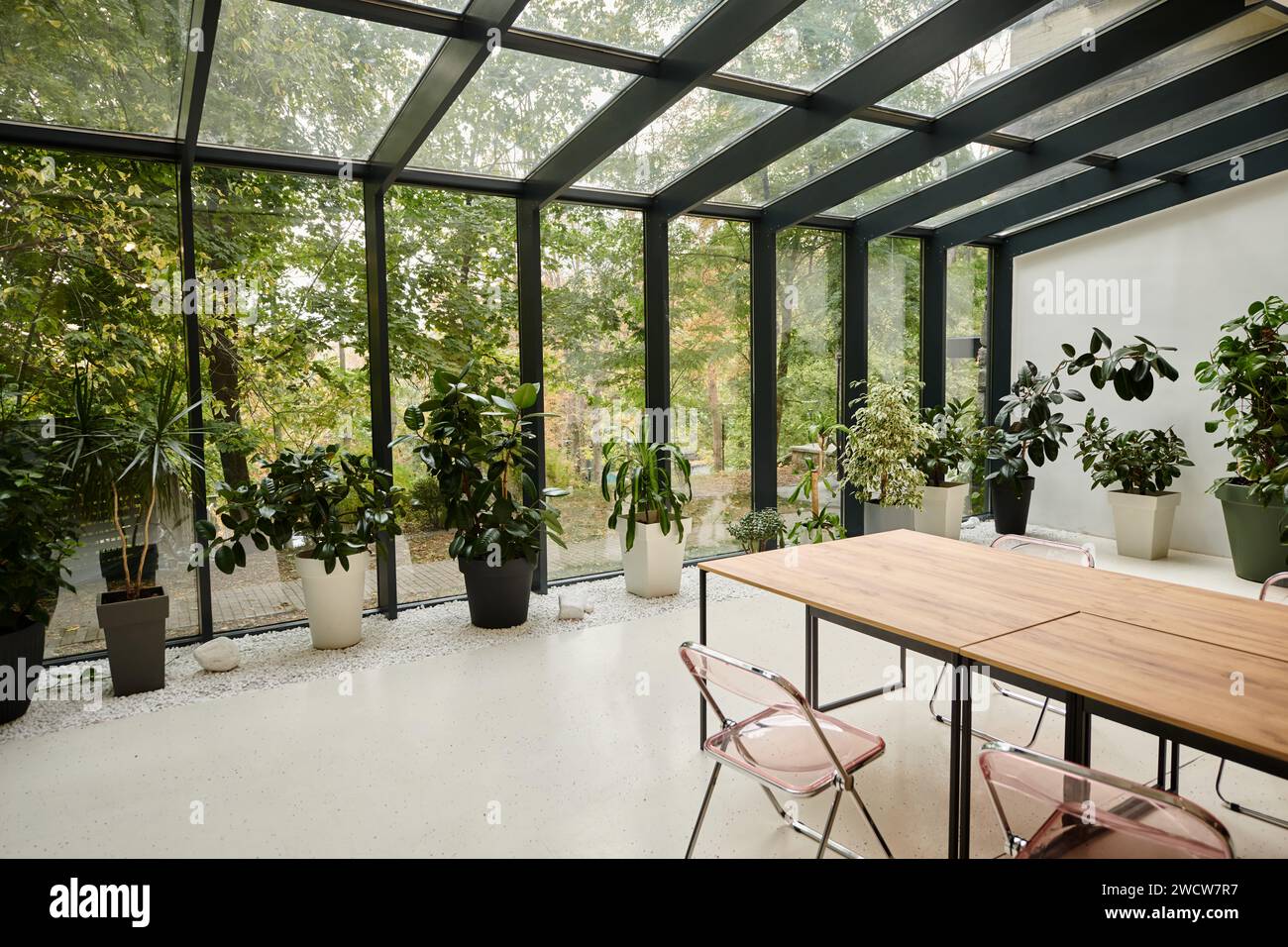 interior photo of contemporary minimalist meeting room with tables and ...