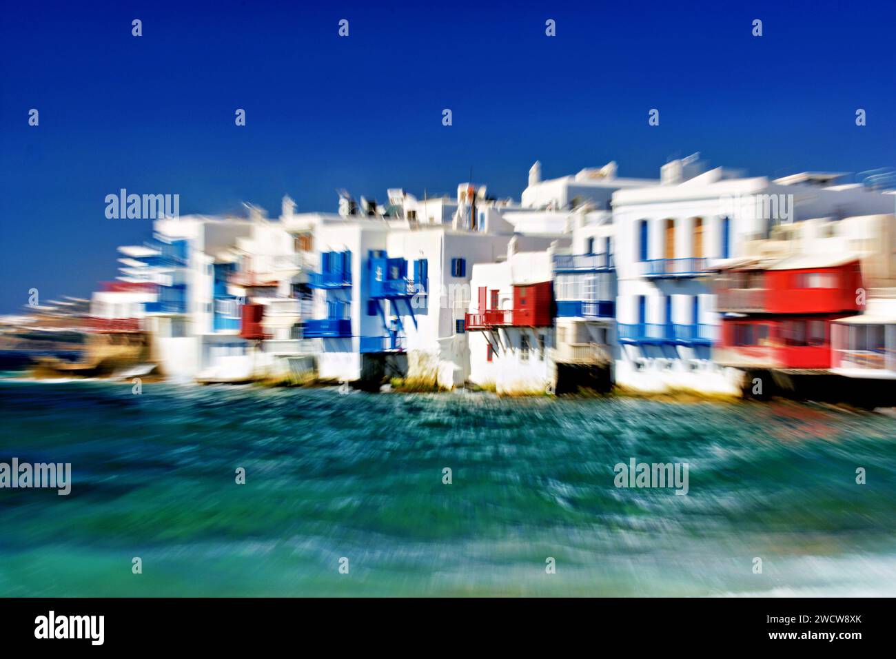 view of Mykonos harbor on a sunny summer day by ICM fotography Stock Photo