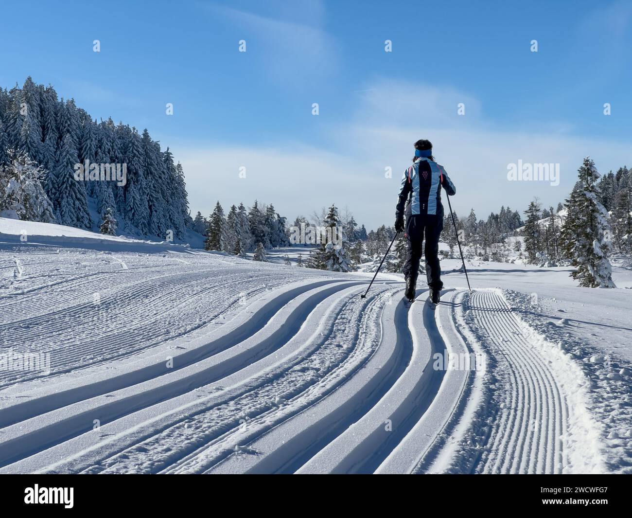 nice and active senior woman cross-country skiing in the Hochhaedrich area of Bregenz Forest in Vorarlberg, Austria Stock Photo