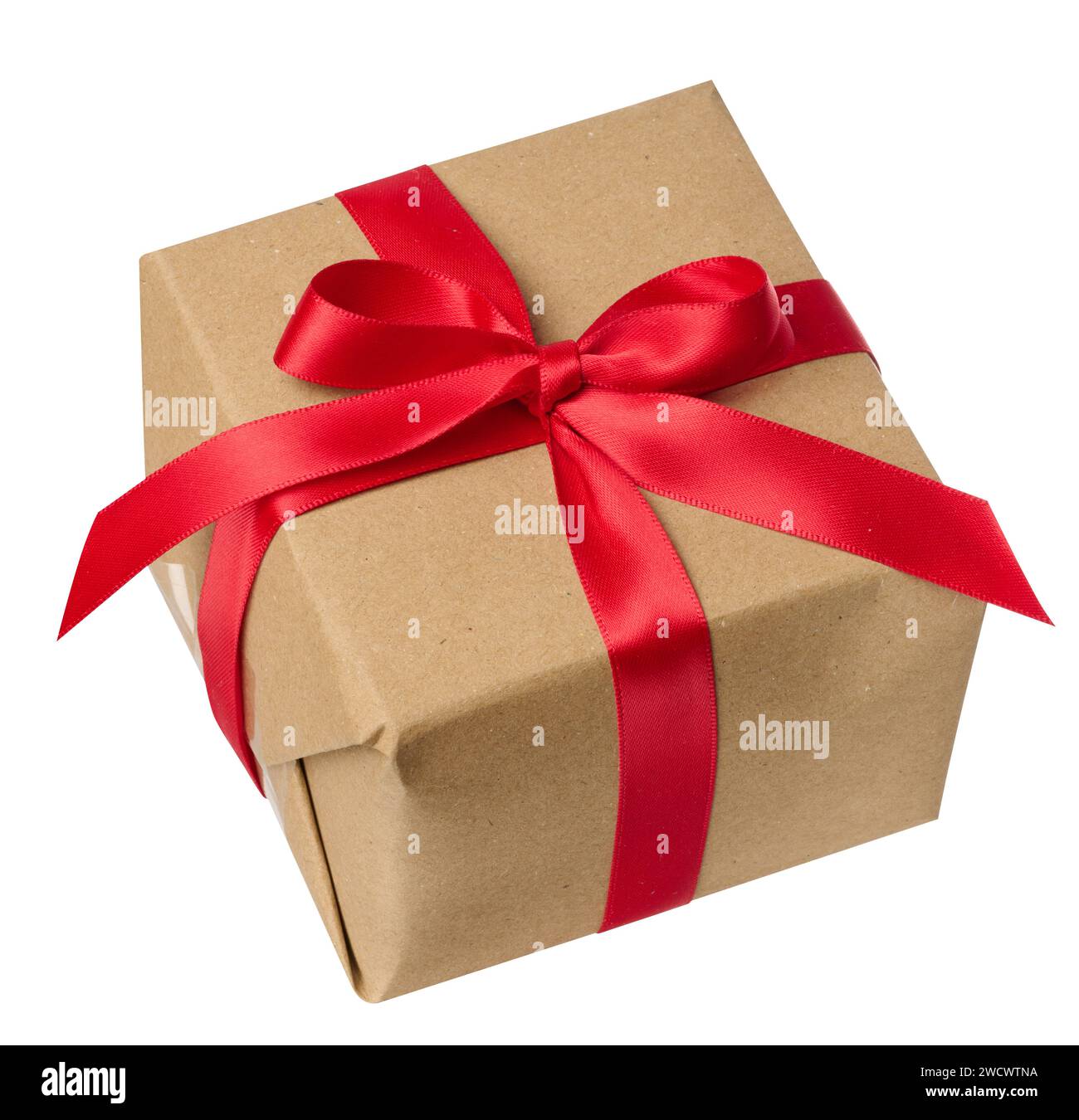 Box is wrapped in brown paper and red ribbon on a white isolated ...