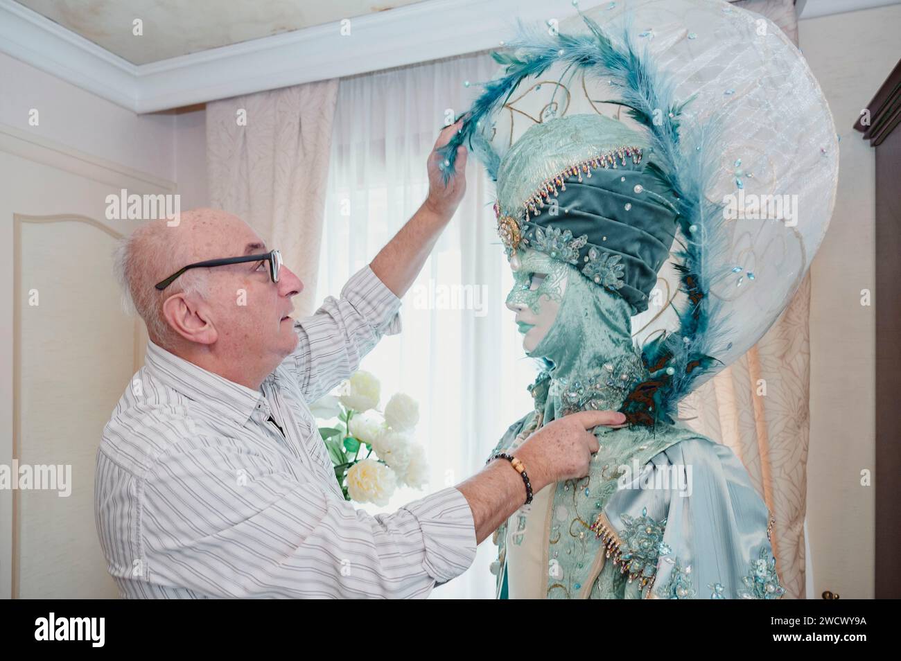 France, Haute Savoie, Annecy, Venetian carnival, Georges Mouchet works to build a new costume for the 2024 carnival season called Contes d'Orient, adjustment of the sphere headdress Stock Photo