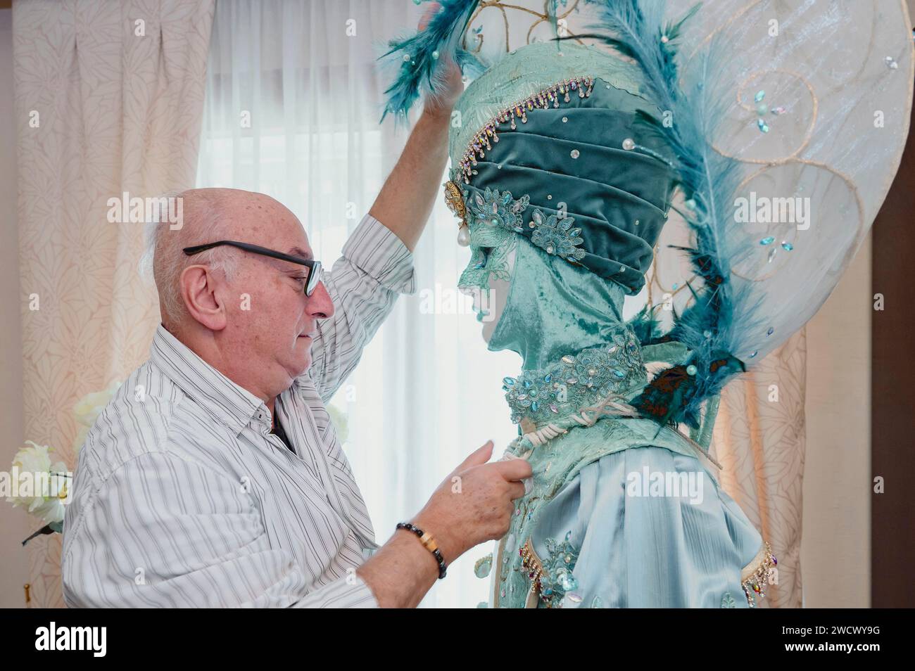 France, Haute Savoie, Annecy, Venetian carnival, Georges Mouchet works to build a new costume for the 2024 carnival season called Contes d'Orient, adjustment of the sphere headdress Stock Photo