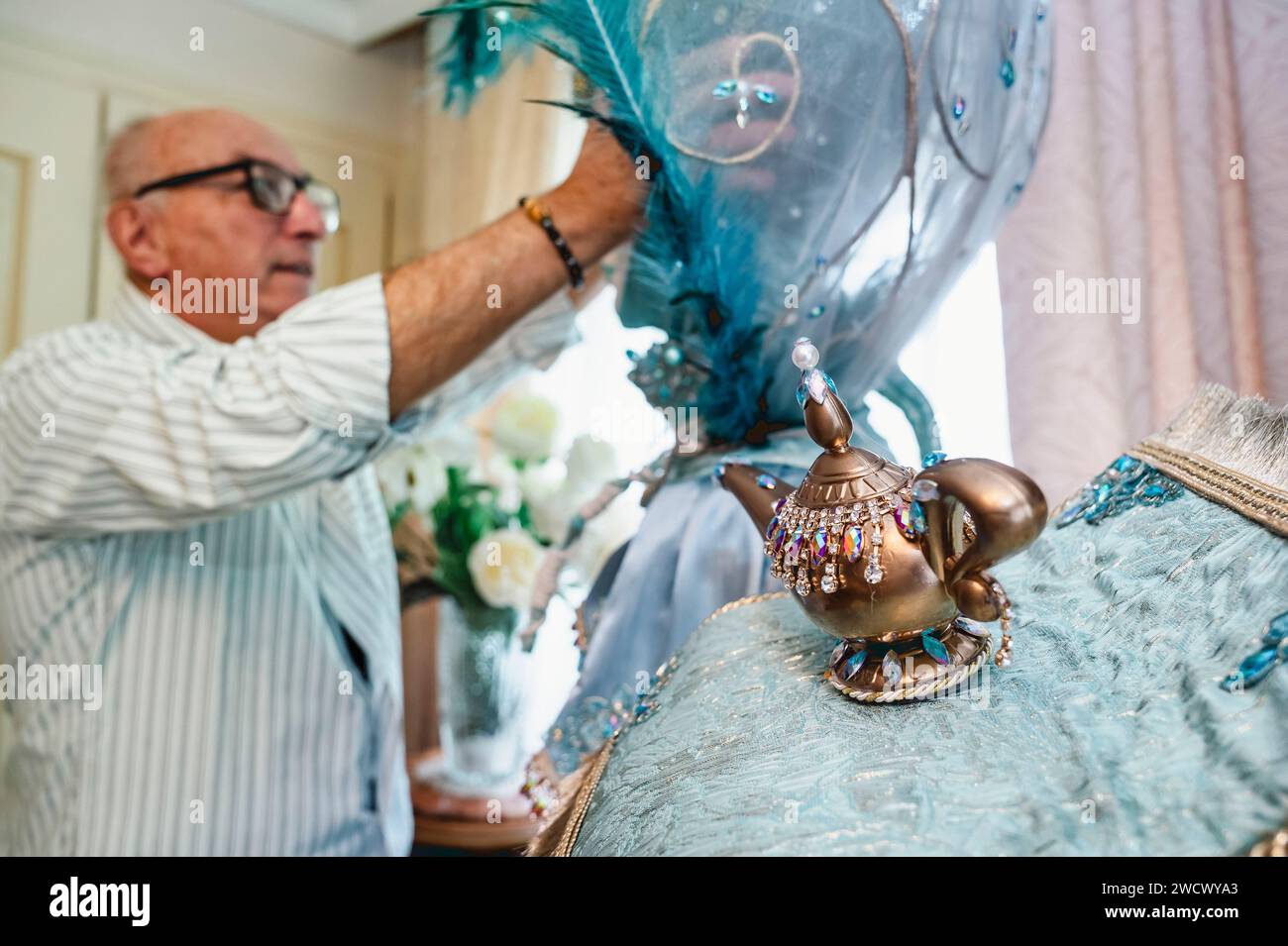France, Haute Savoie, Annecy, Venetian carnival, Georges Mouchet works to build a new costume for the 2024 carnival season called Contes d'Orient, adjustment of the sphere headdress Stock Photo