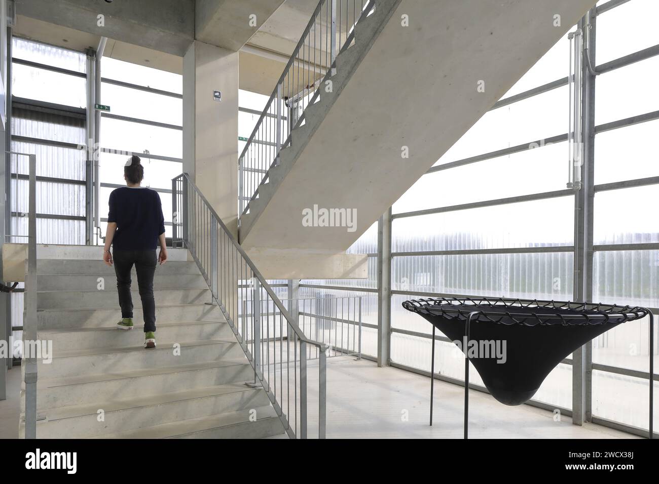 France, Nord, Dunkirk, FRAC Grand Large / Hauts-de-France designed by architects Lacaton & Vassal, staircase with on the right a work by the Venezuelan artist Angyvir Padilla Stock Photo