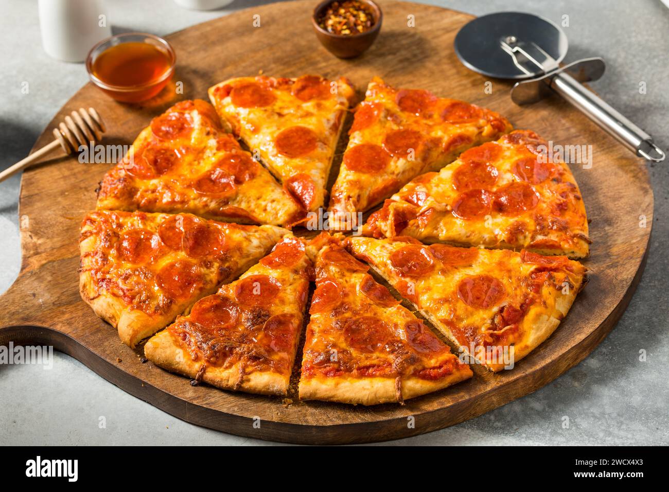 Homemade Spicy Hot Honey Pepperoni Pizza with Cheese and Sauce Stock