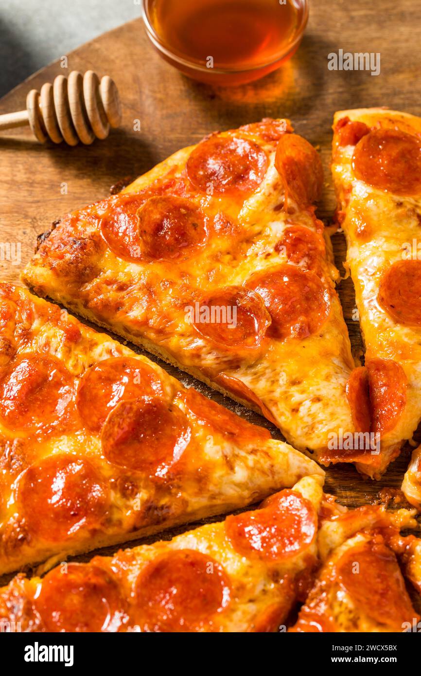Homemade Spicy Hot Honey Pepperoni Pizza with Cheese and Sauce Stock