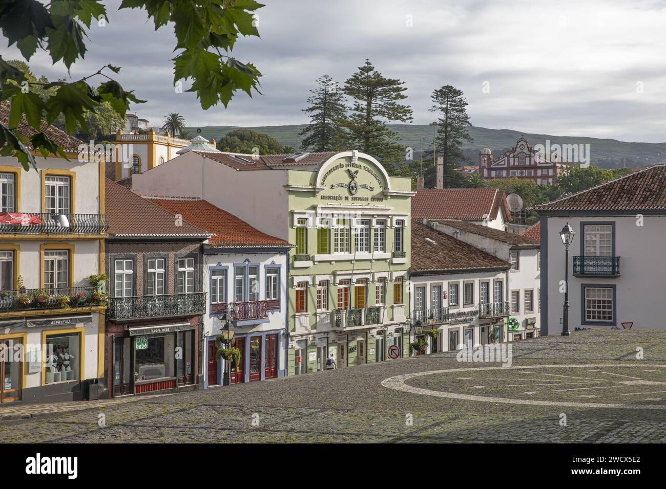 Portugal, Azores archipelago, Terceira island, Angra do Heroismo, Rua da Se, colonial houses with colorful facades on the main street of the historic center from the cathedral esplanade Stock Photo