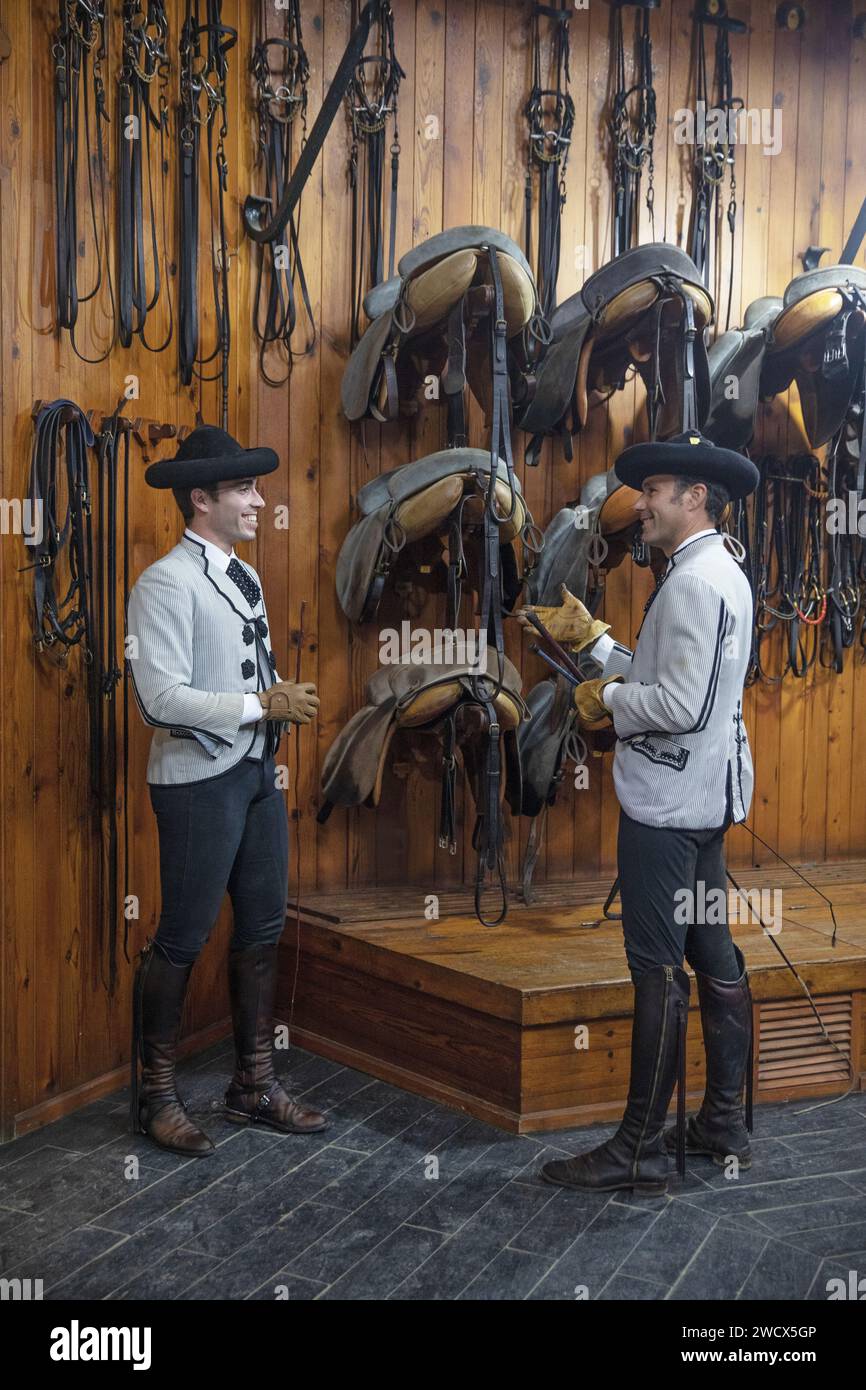 Spain, Andalusia, Jerez de la Frontera, royal Andalusian school of equestrian art, riders in Goyesque costume in the tack room of the stables Stock Photo
