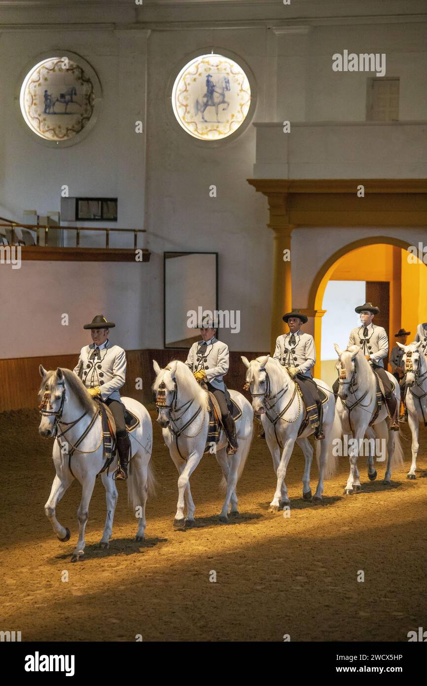 Spain, Andalusia, Jerez de la Frontera, royal Andalusian school of equestrian art, riders in Goyesque costume parading on their white horses during an exhibition show of doma vaquera, the art of Andalusian dressage Stock Photo