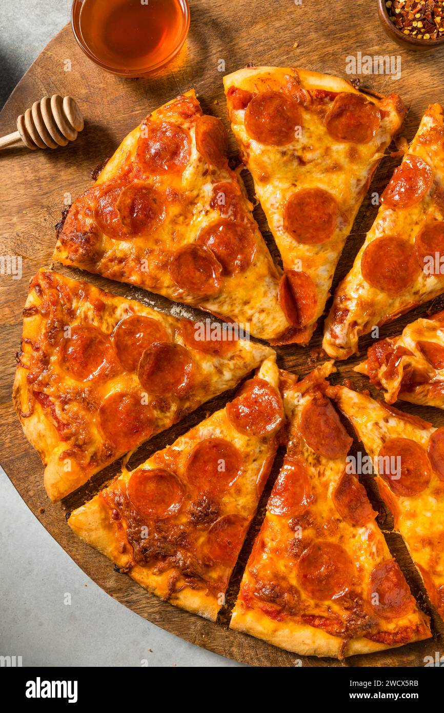Homemade Spicy Hot Honey Pepperoni Pizza with Cheese and Sauce Stock