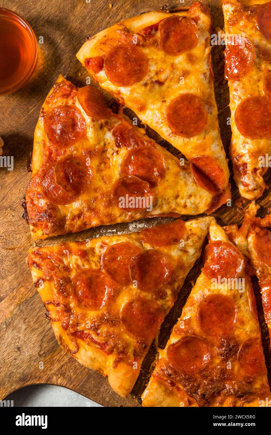 Homemade Spicy Hot Honey Pepperoni Pizza with Cheese and Sauce Stock