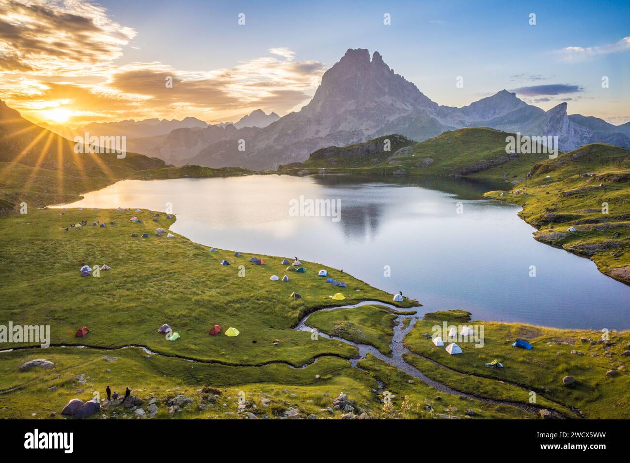 France, Pyrenees Atlantiques, Béarn, Ossau valley, Pyrenees National Park, camp on the edge of the Ayous lake at sunrise, the Pic du Midi d'Ossau in the background Stock Photo