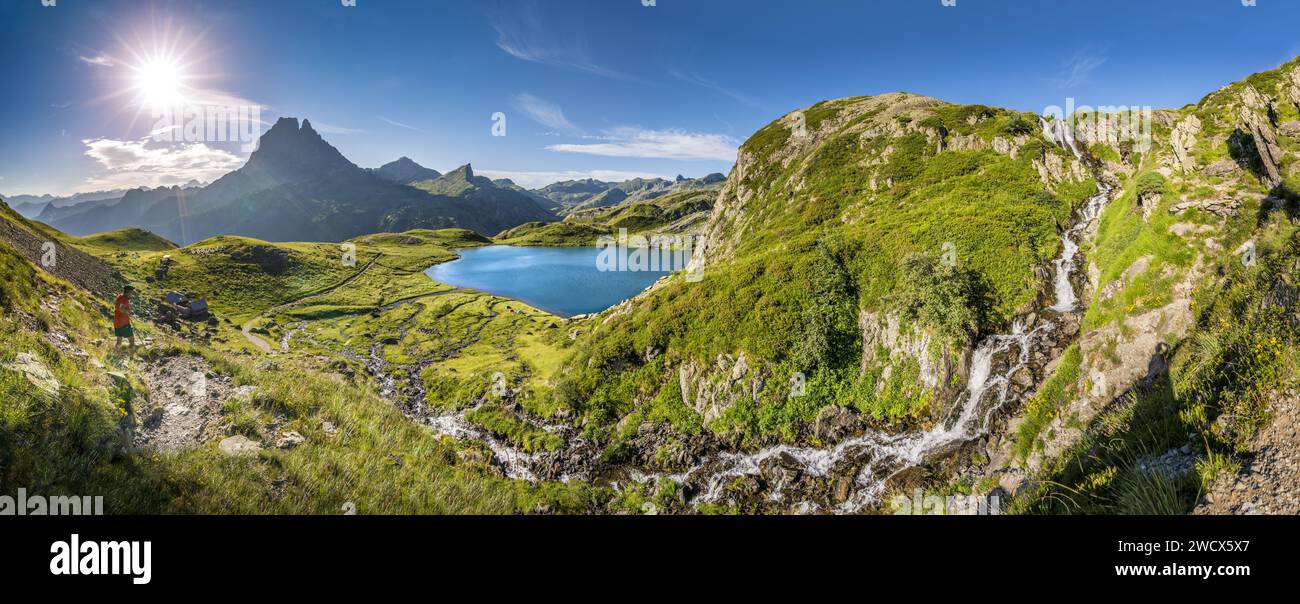 France, Pyrenees Atlantiques, Béarn, Ossau valley, Pyrenees National Park, panoramic view from the waterfall leading to the Roumassot hut and its herd of ewes and goats in summer pasture, on the edge of Bersau lake Stock Photo