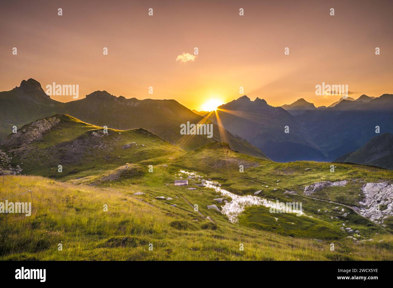France, Pyrenees Atlantiques, Béarn, Ossau valley, Pyrenees National Park, sunrise over the peaks opposite the Pombie refuge Stock Photo