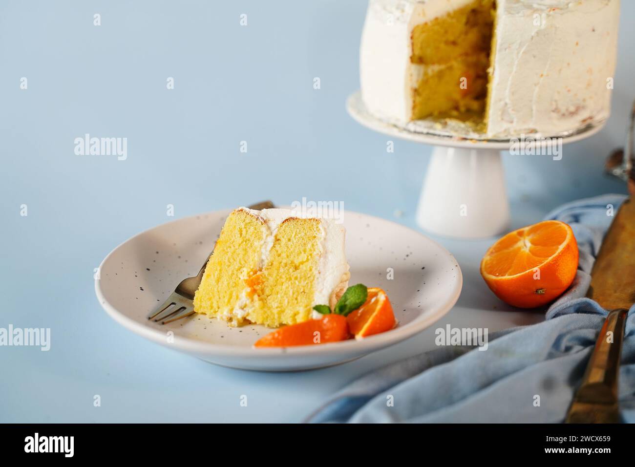 Homemade Mandarin orange cake with whipped cream frosting Stock Photo