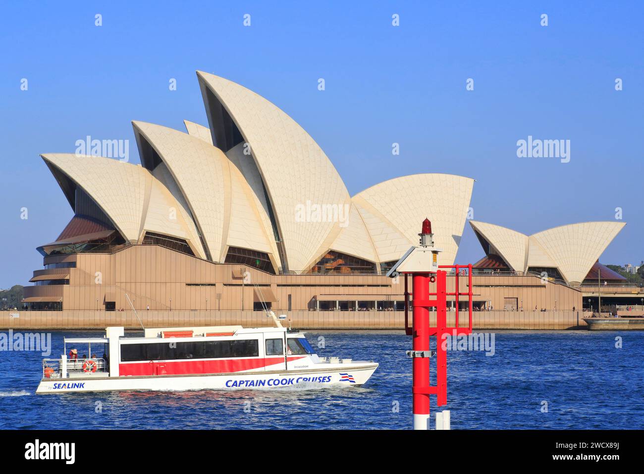 Australia, New South Wales, Sydney, Bennelong Point, ferry in front of the Opera House (Sydney Opera House) designed by the Dane Jørn Utzon and inaugurated in 1973 Stock Photo