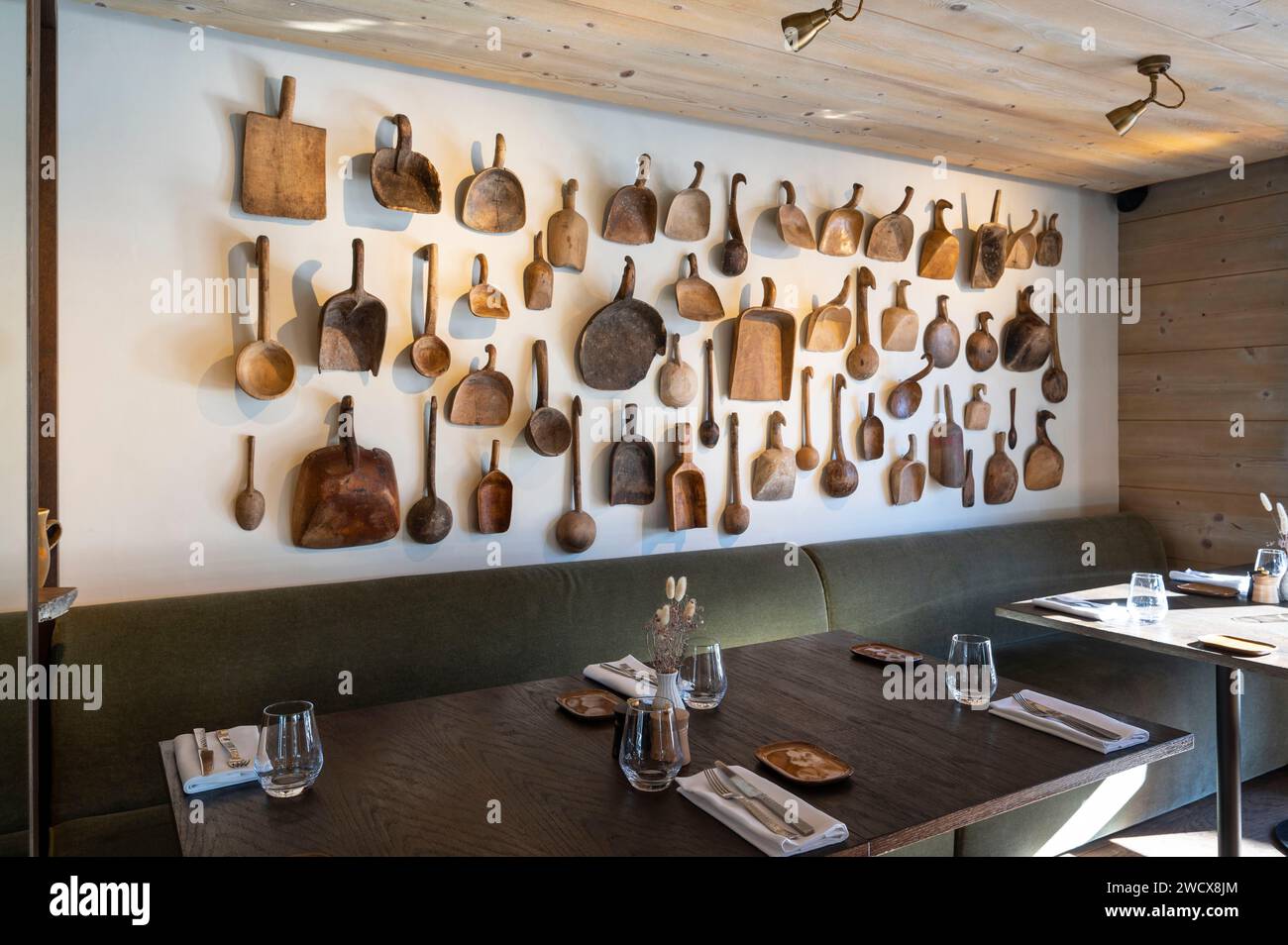 France, Haute Savoie, Megeve, 5-star hotel l'Alpaga, in the room of the restaurant Bistro de l'Alpaga, a collection of wooden curd shovels Stock Photo