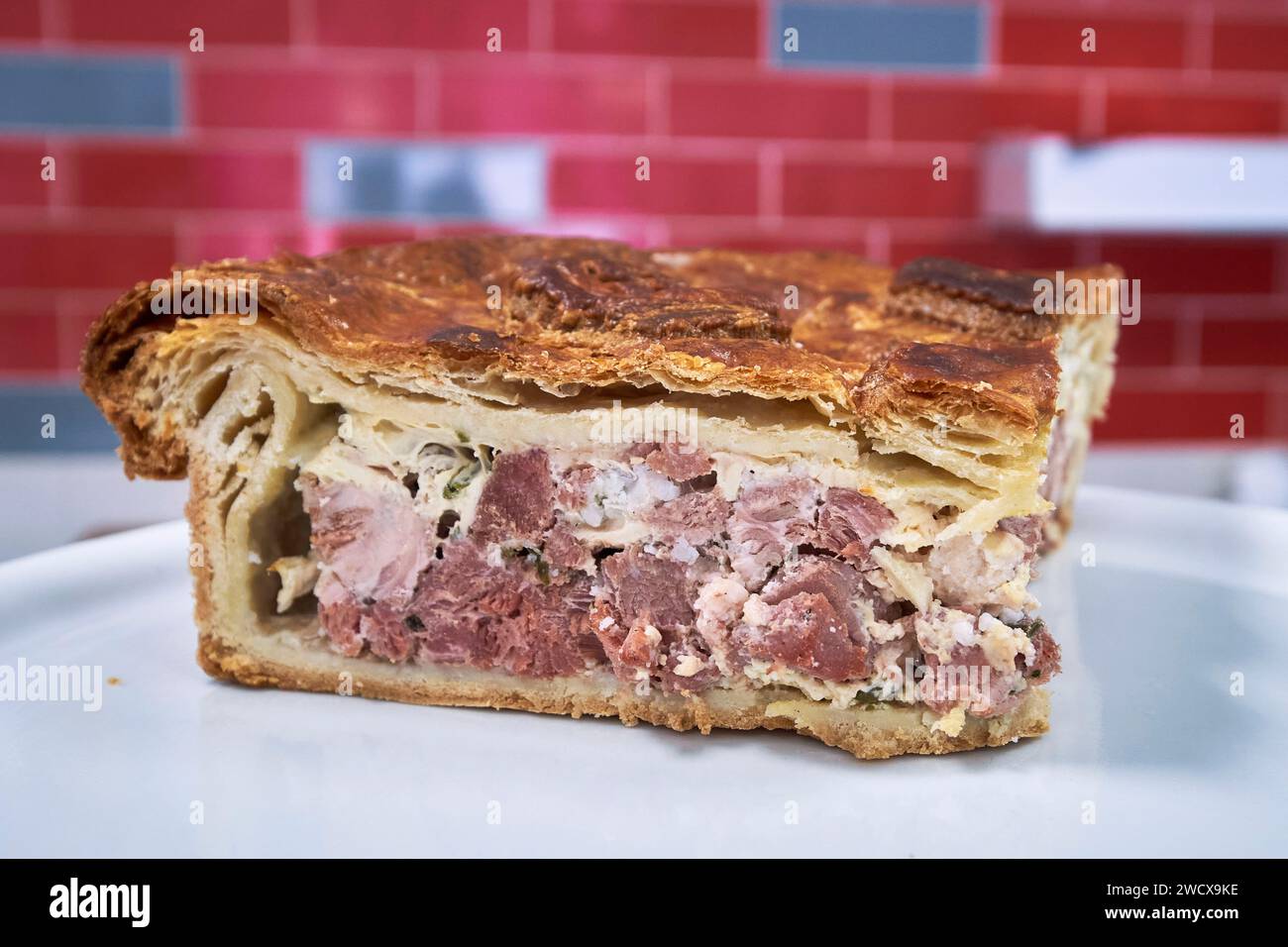 France, Moselle, Ancy Dornot, Maison Saint Clement, the real Lorraine pie with its homemade puff pastry, made from pork marinated in white wine and garnished with migaine (eggs and fresh cream) Stock Photo
