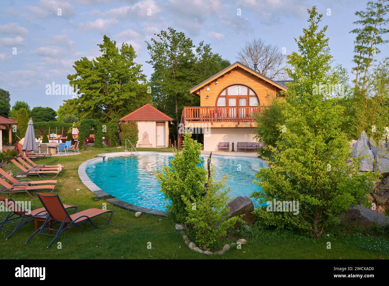 France, Moselle, Conde Northen, Domaine La Grange de Conde, Hotel and Inn Restaurant, the swimming pool and the chalet Reve de Lune Stock Photo