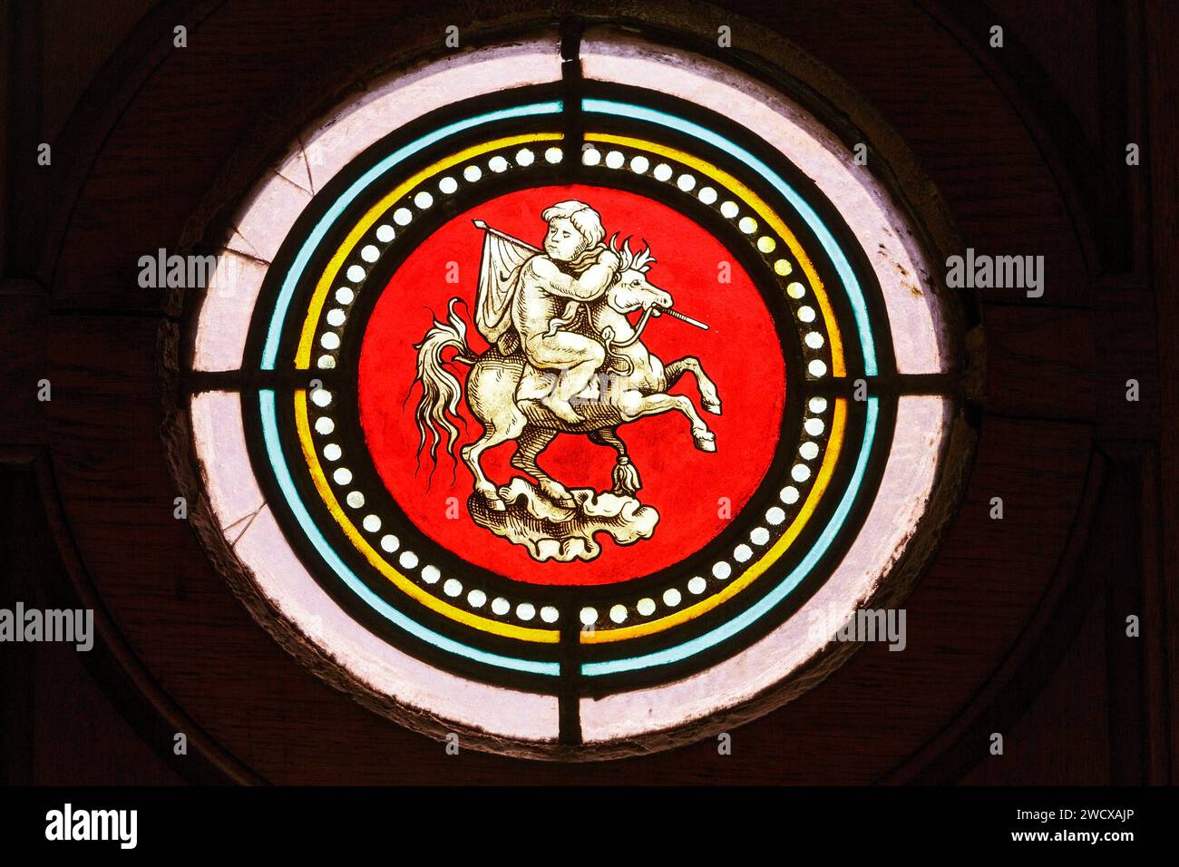 France, Meurthe et Moselle, Nancy, stained glass window representing a child on a horse holding a flag on the door of an apartment building in neoclassical style located Place Maginot Stock Photo