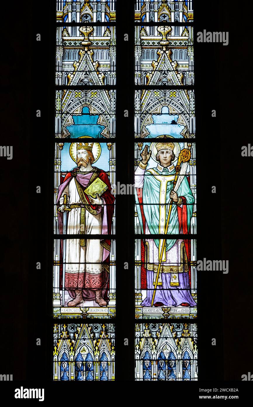 France, Meurthe et Moselle, Nancy, Saint Leon church in neogothic style built between 1860 and 1874 by architect Leon Vautrin, stained glass window made by master glassmaker Louis Charles Marie Champigneulle in 1900 which represents on the left Saint Sigisbert patron saint of the town of Nancy, on the right Saint Stanislas, bishop of Cracovia martyr in 1079 , located Rue Saint Leon Stock Photo