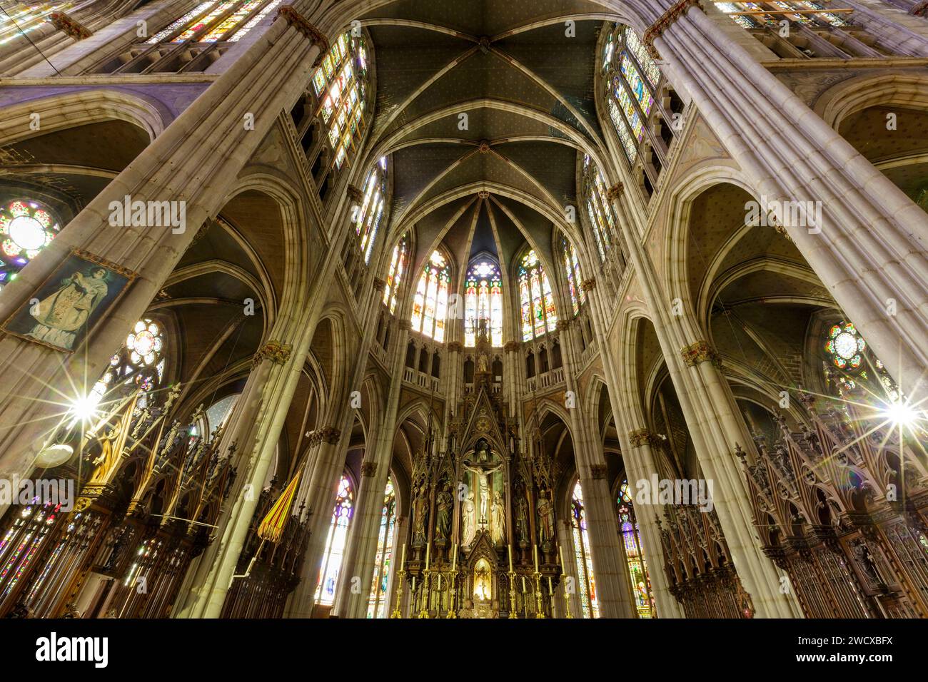 France, Meurthe et Moselle, Nancy, Saint Epvre basilica built in neogothic style by architect Prosper Morey, church's consecration occured in 1871, the choir and the altarpiece of the choir with Jesus Christ on the Cross, at his sides from left to right Saint Epvre, Saint Paul, Saint Peter and Saint Sigisbert, located Place Saint Epvre Stock Photo