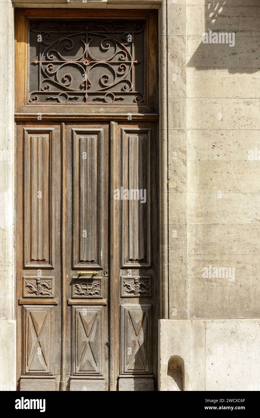 France, Meurthe et Moselle, Nancy, sculpted door made of wood of an apartment building representing a flower of thistle and the cross of Lorraine located Rue Mon Desert Stock Photo