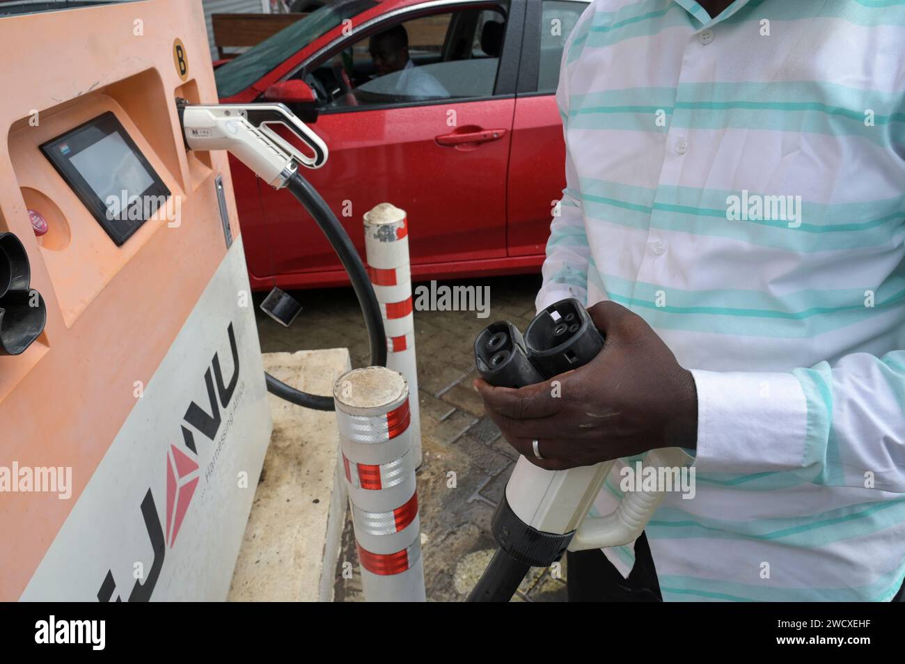 GHANA, Accra, electric mobility, IJANU service and quick charging station for electric cars, Tesla plug / GHANA, Accra, E-Mobilität, IJANU Service und Ladestation für E-Autos, Tesla Ladestecker Stock Photo