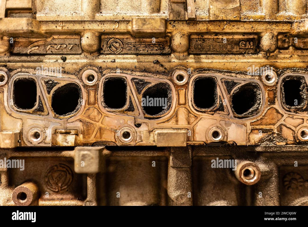 A photo showing dirty intake manifolds in a car engine, impacted by