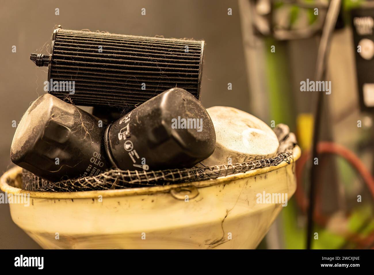 Photo of old, exhausted oil filters in a symbolizing hazardous waste disposal in
