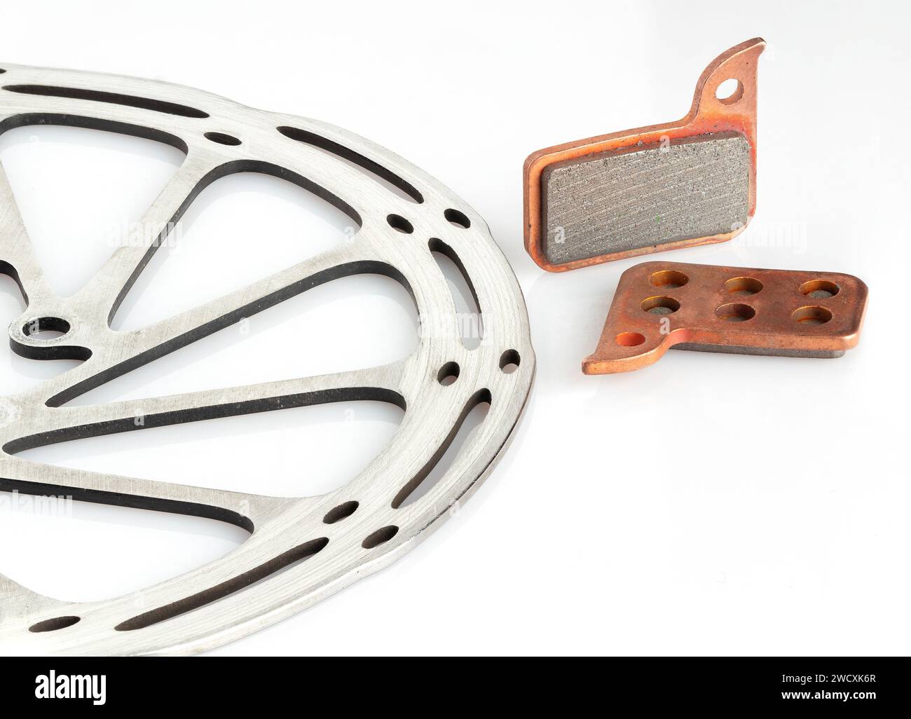 Bicycle brake rotor and new brake pads isolated on a white background Stock Photo Alamy