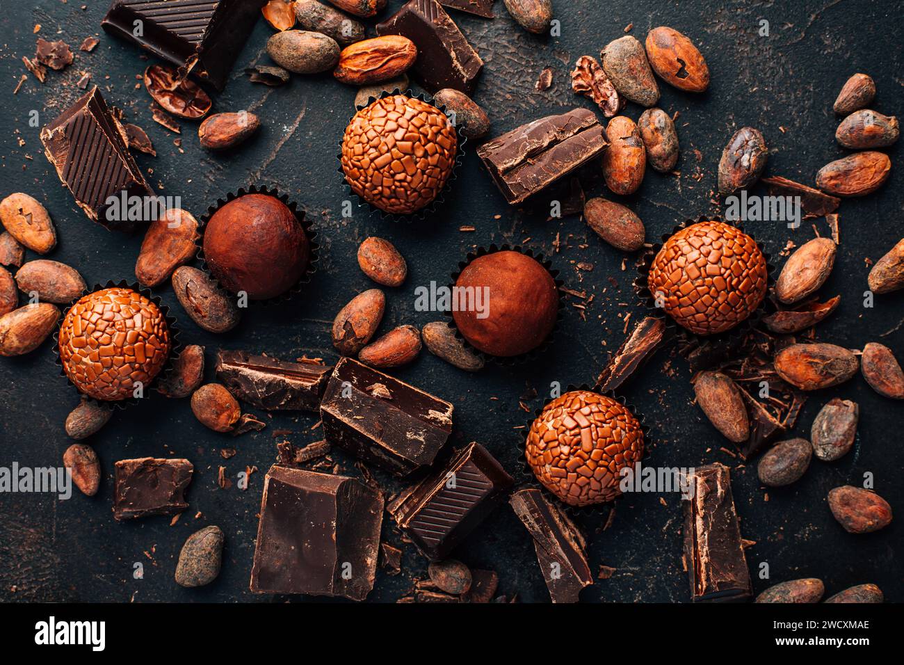 Homemade sweetmeats with chocolate bars and cocoa beans Stock Photo
