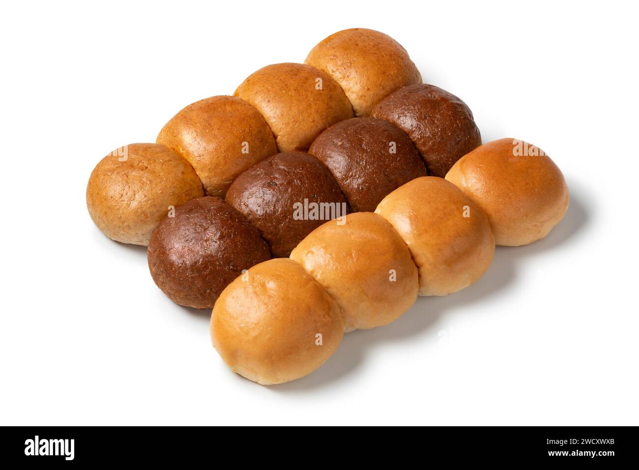 Variation of fresh baked white and brown buns of bread close up isolated on white background Stock Photo