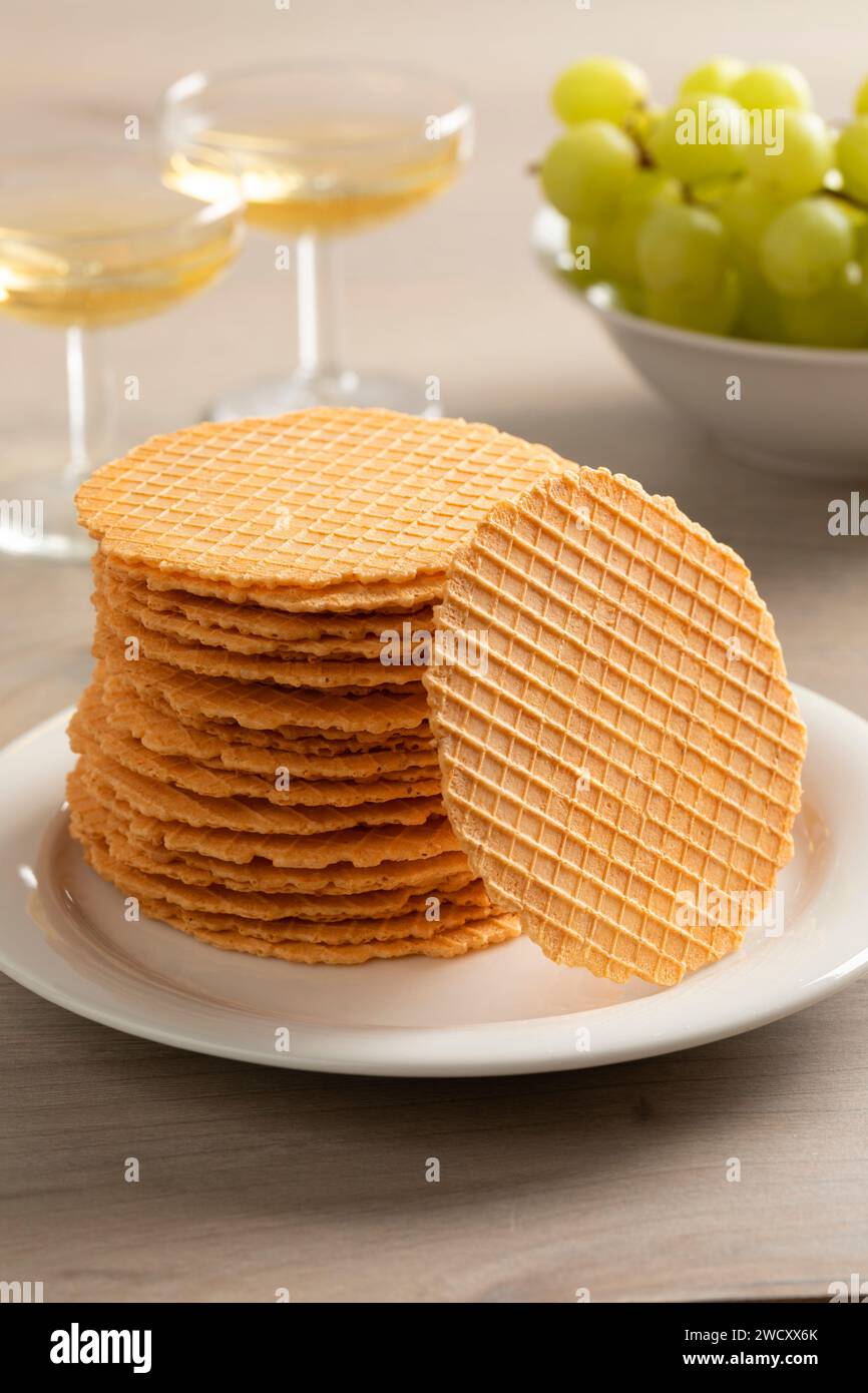 Stack of homemade fresh baked thin cheese waffles as a snack close up Stock Photo