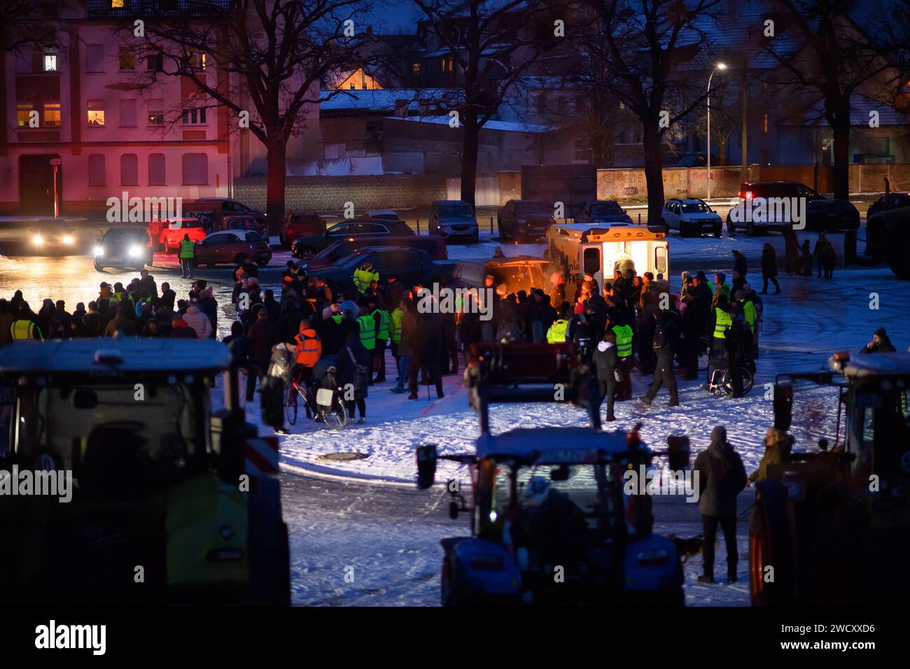 Stendal, Germany. 17th Jan, 2024. Farmers stand around a bonfire they have lit at a rally on the Schützenplatz in Stendal. They are protesting against the federal government's austerity plans. Credit: Klaus-Dietmar Gabbert/dpa/Alamy Live News Stock Photo