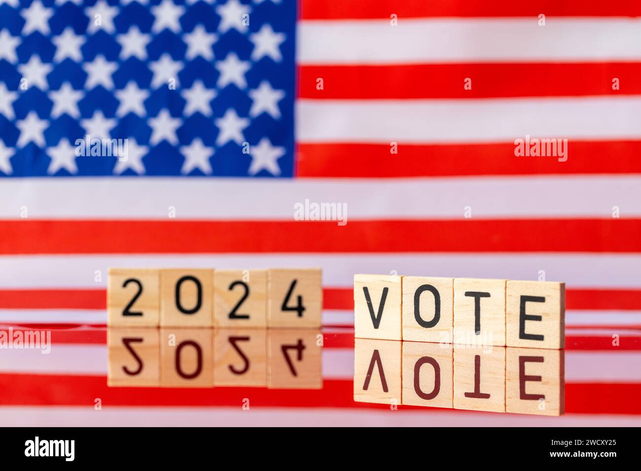 US elections 2024, American flag and the inscription VOTE 2024. The concept of voting in the United States in 2024. Stock Photo