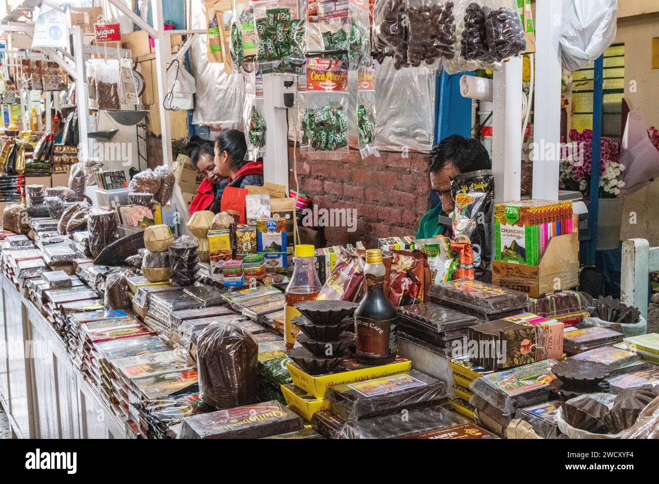 A shop inside San Pedro mercado market selling salt, coca, trinkets, chocolate in Cusco, Peru Stock Photo