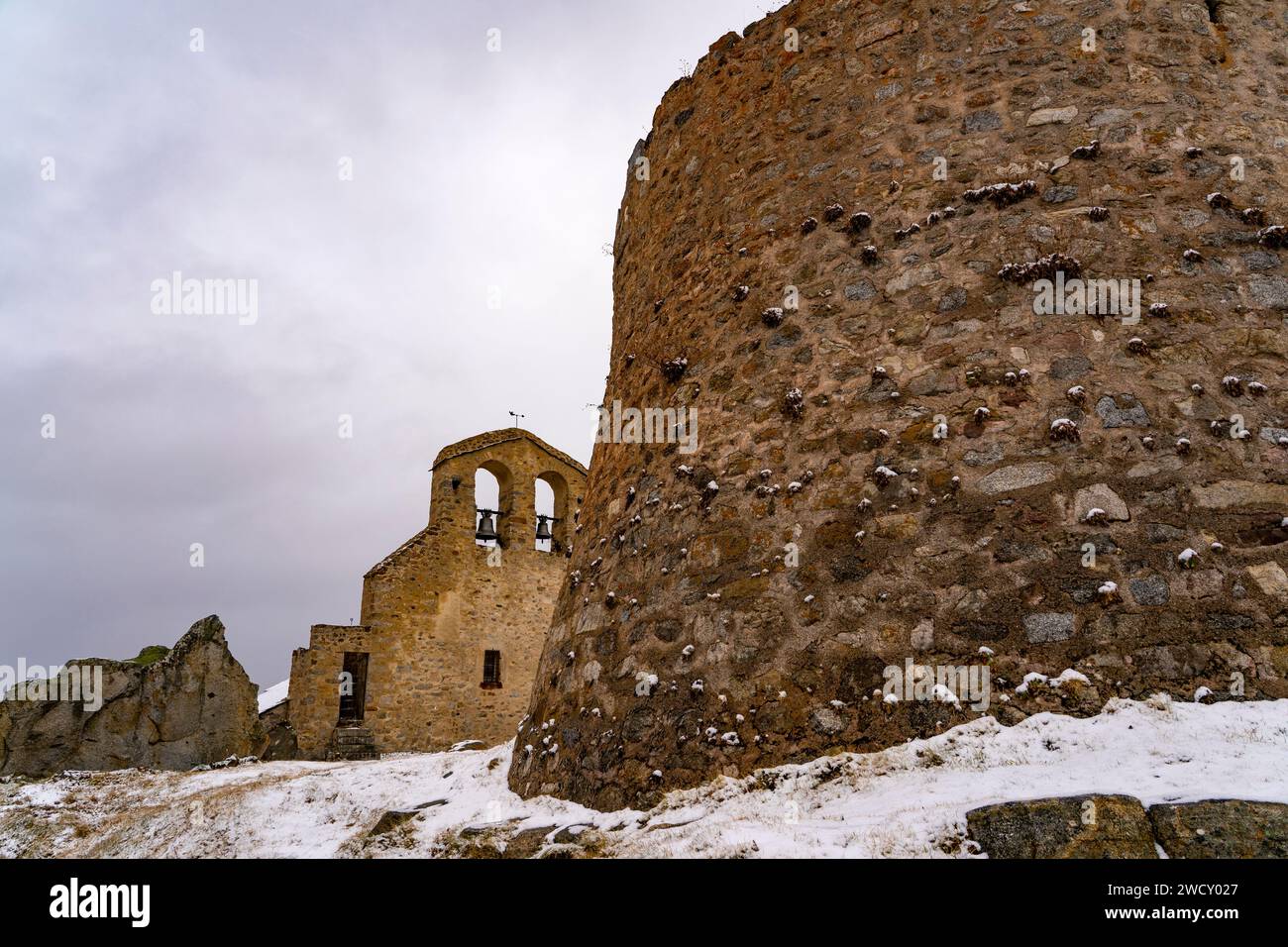 Castrum and Église Saint-Vincent de La Llagonne, Capcir, Pyrenees Oriental, France with twoer - Castrum de La Llagonne Stock Photo