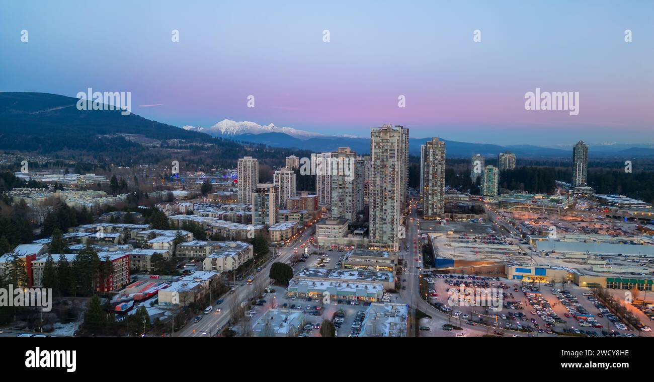Buildings and Residential Homes near Town Centre. Aerial City Sunset. Stock Photo