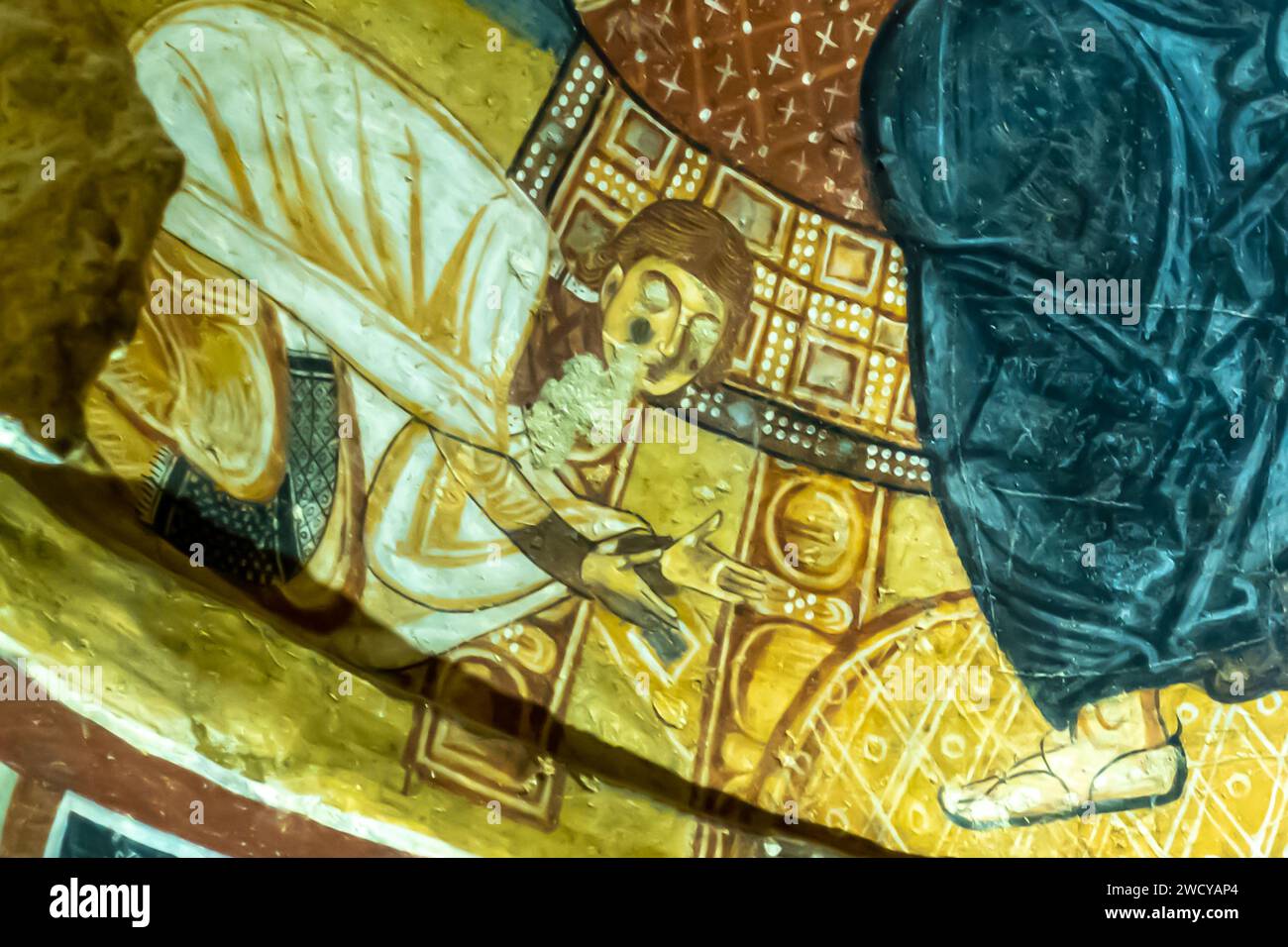 A detail of Karanlik Dark Church frescoes, Goreme museum of cave churches, Cappadocia Turkey  11th century. Medieval man worshipping on his knees Stock Photo
