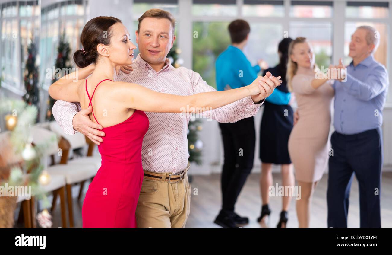 Woman and man dancing slow ballroom dance in choreography studio Stock ...