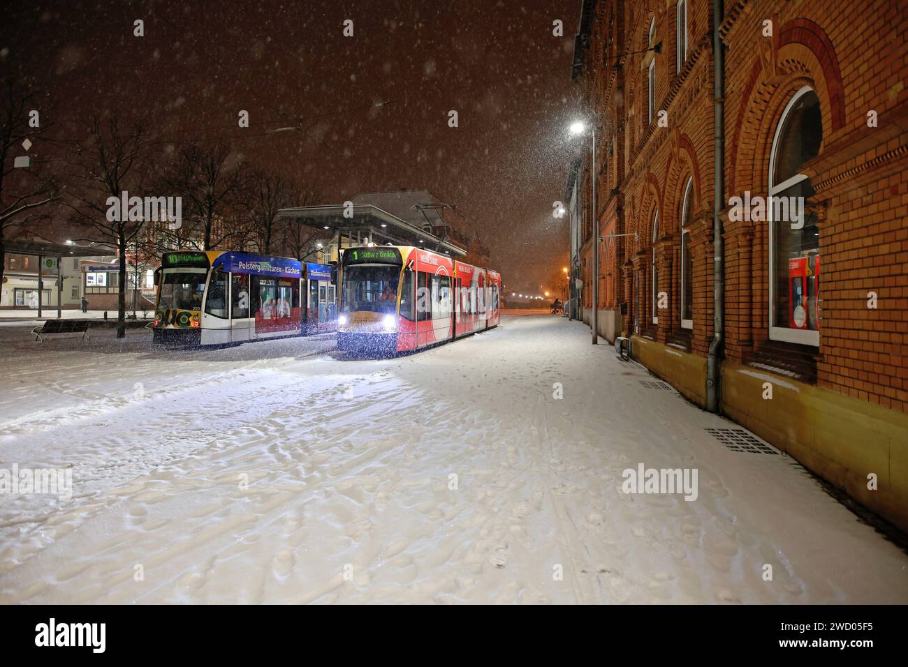 Nordhausen, Germany. 17th Jan, 2024. Two streetcars stand on the snow