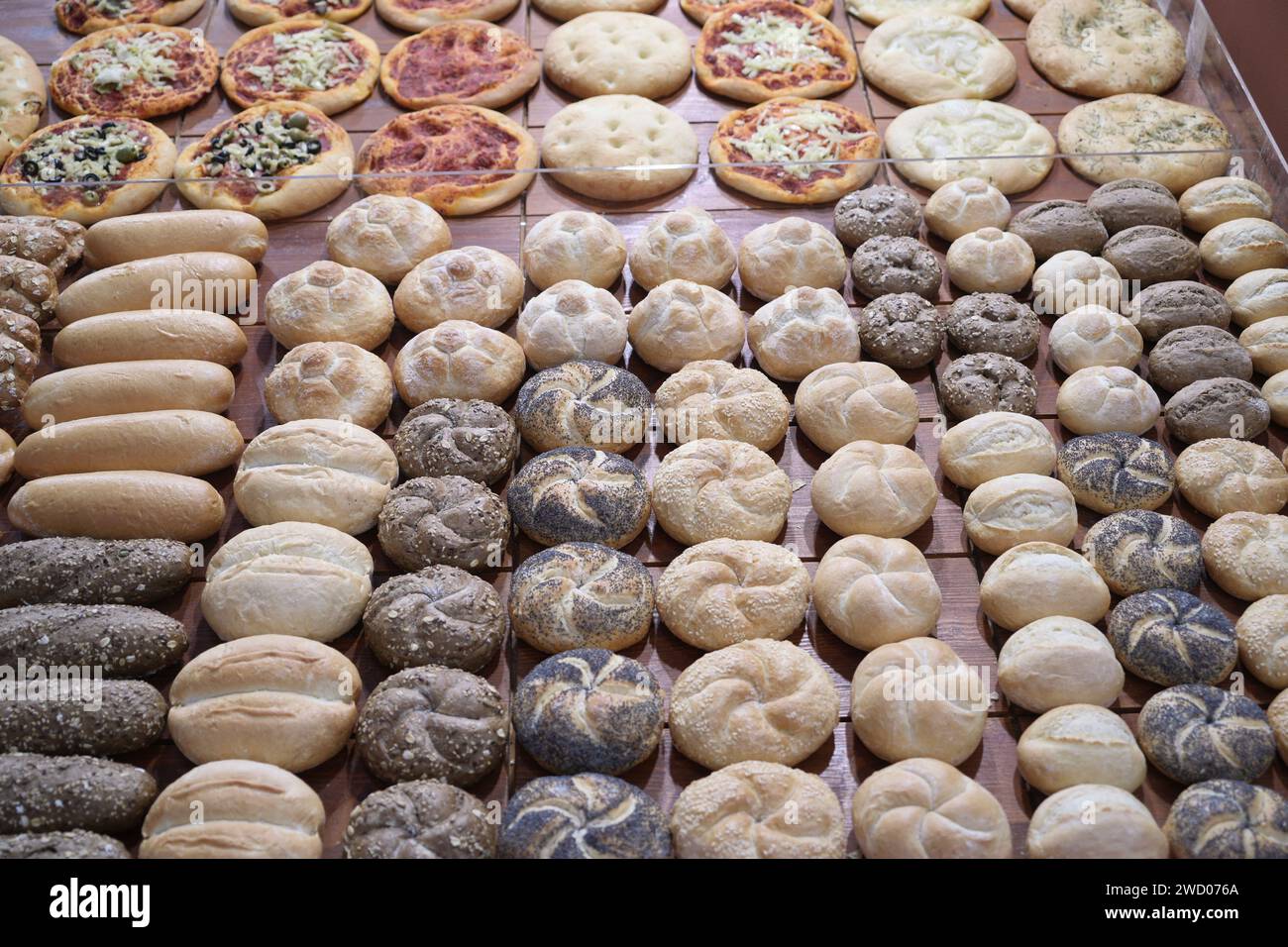 Milan, Italy January 17, 2024 Fresh bread on shelves in a bakery