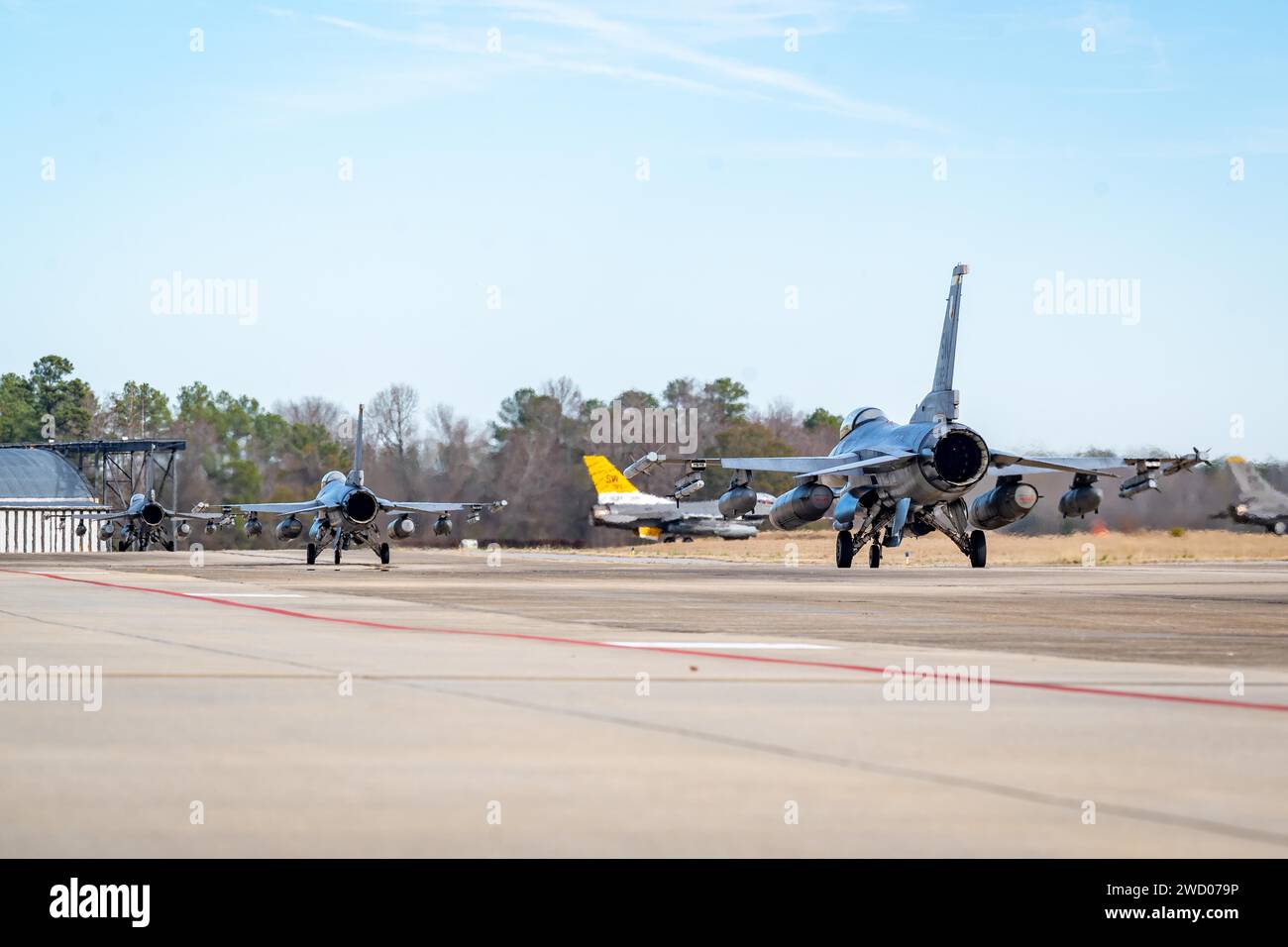 U.S. Air Force F-16C Fighting Falcons assigned to the 79th Fighter Squadron (FS) leave for Red Flag-Nellis (RFN) 24-1 from Shaw Air Force Base, S.C., Jan. 11, 2024. RFN 24-1 provides 79th FS pilots a higher caliber of training in strategy, force design and adversary warfighting, ensuring the 20th Fighter Wing is capable of providing world class combat airpower anytime, anywhere. (U.S. Air Force photo by Airman 1st Class Steven Cardo) Stock Photo
