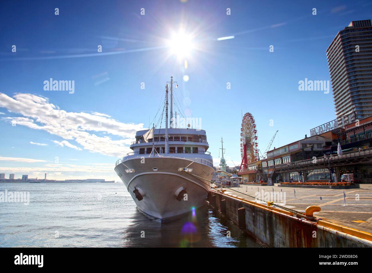 A cruise ship moored alongside Mosaic Mall at the Kobe Harborland Port in Kobe, Hyogo Prefecture, Japan. Stock Photo
