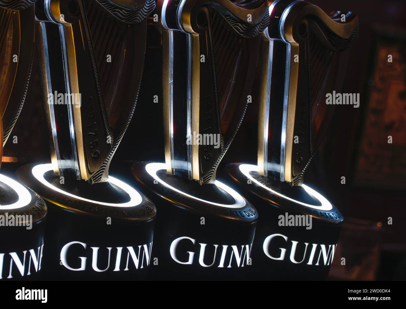 Pumps for draught Guinness in an Irish bar Stock Photo