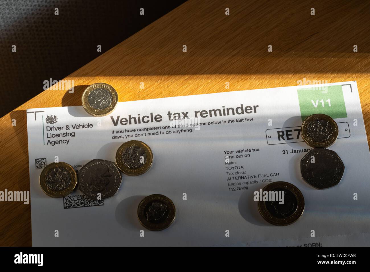 A V11 Vehicle Tax Reminder form sent from the DVLA to individual car owners in the UK, reminding them to tax their car / vehicle. England Stock Photo