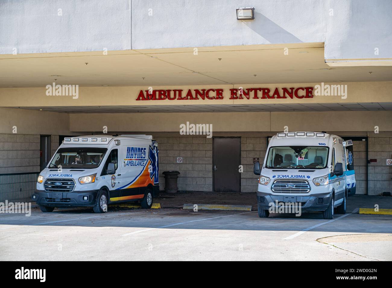 Hospital emergency room ambulance entrance with two ambulances parked to off-load patients in Montgomery Alabama, USA. Stock Photo