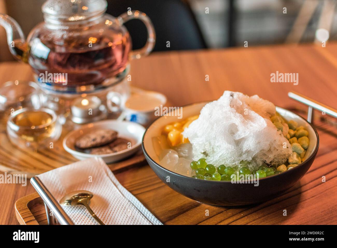 Transparent glass herbal teapot Stock Photo