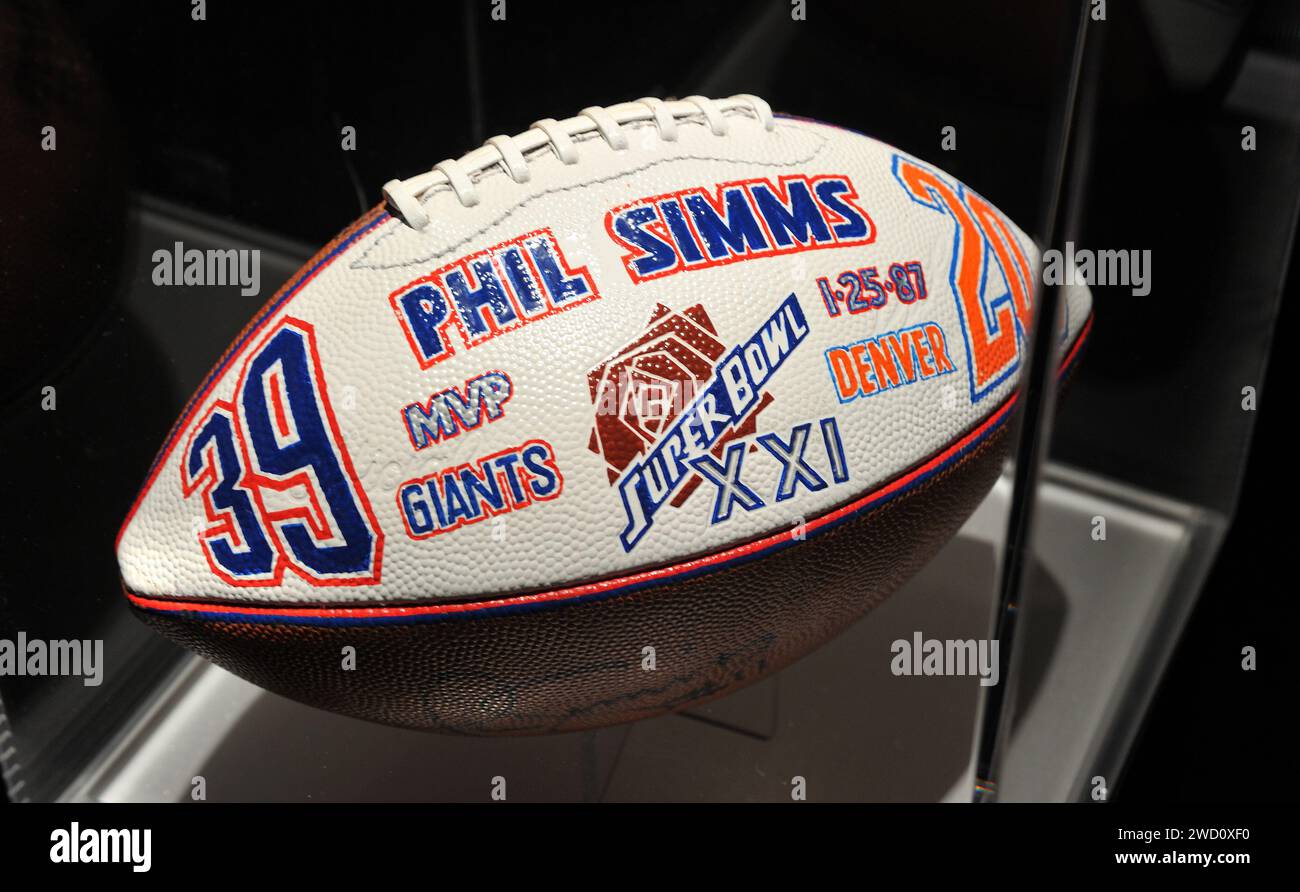 New York, USA. 17th Jan, 2024. Commemorative Super Bowl XXI (1987) football autographed by Phil Simms on display at the Beyond the Big Game exhibition at the Paley Center in New York, NY on January 17, 2024. (Photo by Stephen Smith/SIPA USA) Credit: Sipa USA/Alamy Live News Stock Photo